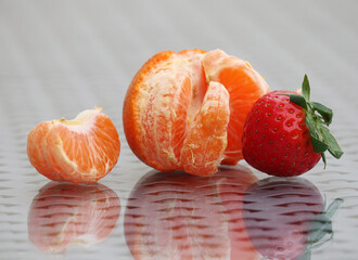 Ripe strawberry and tangerine
