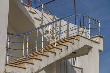 outdoor staircase with stainless railings in the house 1