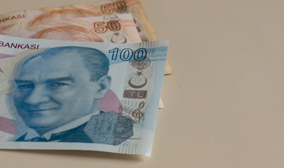 Turkish money, closeup of hundreds of Turkish lira banknotes on light background. concept surface...