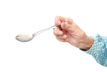 The hand of a 95-year-old elderly woman holds a spoon, isolated on a white background.Rheumatoid polyarthritis of the hands of a 95-year-old woman.