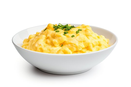 scrambled eggs with herbs in a bowl on white background