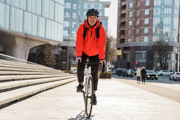 Active cyclist in high-visibility gear commuting in an urban environment.