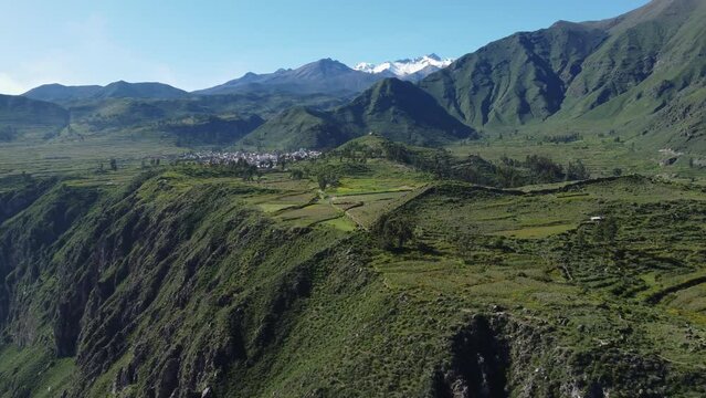 Colca Canyon, Peru: Aerial drone footage of the Cabanaconde town at the edge of the Colca Canyon in the Andes mountains in Peru in south America