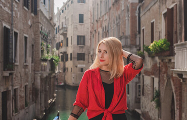 Vacation in Venice - Italy. Concept of tourism and holidays. Woman in city scene