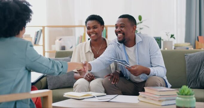 Home, couple and insurance agent with documents, handshake and conversation in a living room. People, man or women with paperwork, shaking hands or real estate with planning, consultation or property