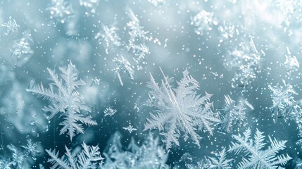 Frozen window glass frosty background with snowflakes.
