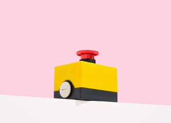 Hand start red button on table.