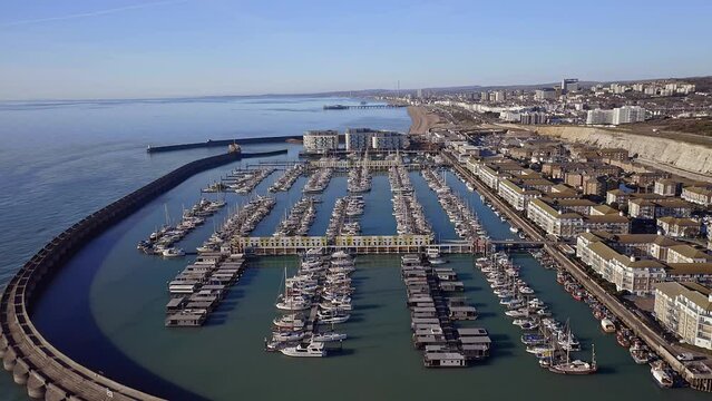 Brighton Marina in East Sussex, Southern England, with Brighton beach in view, a popular holiday destination, aerial video.