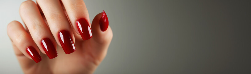 Woman hand with red nail polish on her fingernails. Manicure concept. - obrazy, fototapety, plakaty