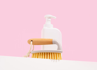 Eco friendly cleaning brush and white cleaning gel dispenser. Household necessary equipment.