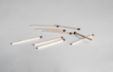 matches are scattered on the table. match on a white background
