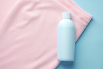 Obraz na płótnie Canvas Mockup bottle of fabric softener or detergent over textile astel background