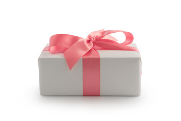 White gift box with pink ribbon bow isolated on white background