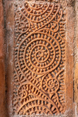 Closeup view of terracotta floral and geometric design on exterior wall of ancient Chachra Shiva temple aka Shiv mandir, Jessore, Bangladesh	
