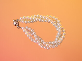 Elegant white beads. Luxury jewelry composition. Beauty routine.