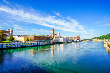 View of some buildings and the surrounding landscape by the river in the city of Passau.
