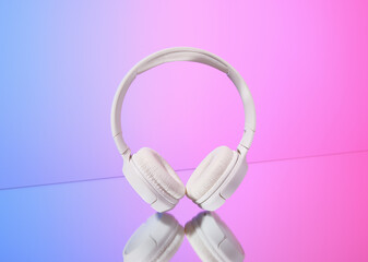 White headphones, stylish accessory. Radio, music.