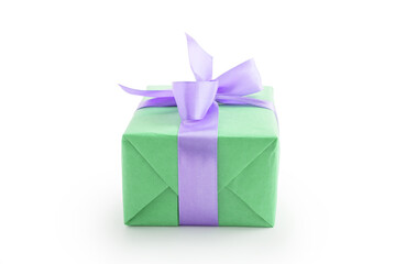 Green paper present box with violet ribbon bow isolated on white background