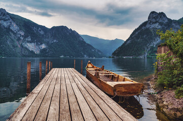 small rowing boat, called "Plätte" in austria, on the shore of lake Traunsee, Austria