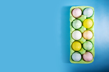 Easter egg box on blue background, festive DIY