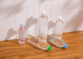 Clean drinking water in plastic bottles on the table. Two bottles lying on the table.