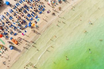 Zelfklevend Fotobehang Aerial view on beach, people and umbrellas. Vacation and adventure. Europe, Mediterranean Sea. Top view from drone at beach and azure sea. View on the coast from drone. © biletskiyevgeniy.com