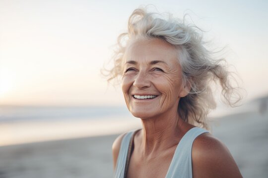Portrait of a smiling old woman on the beach
