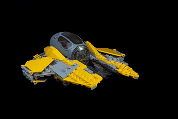 Naklejka premium Depok, Indonesia - January 16, 2024: Lego toys photography, lego anakin skywalker's jedi starfighter on solid black background