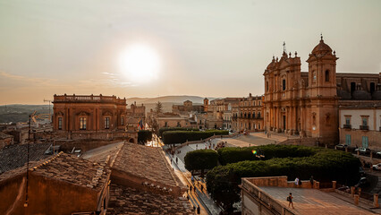 Fototapeta premium the main street of the historic center of Noto seen at sunset from the terrace of a church