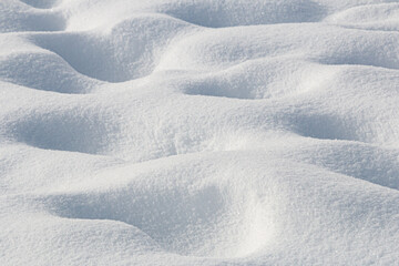 Natural pattern in pure fresh white snow winter abstract background