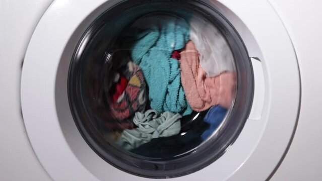 Laundry, clothes are washed in the drum of a washing machine