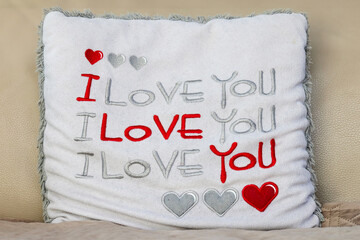 Soft cushion in sofa with text I love you