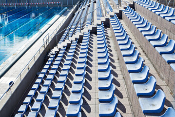 Plastic seats at outdoor swimming pool