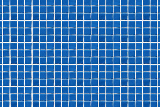 Blue square ceramic tile background. Swimming pool texture. Geometric wall decoration. Home bathroom floor. Ornamental patchwork. Simple square design. White fugue grid.