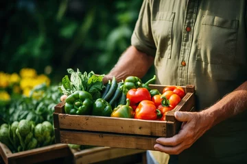 Foto auf Acrylglas Alte Türen closeup of a farmer's hands holding a wooden box with organic vegetables