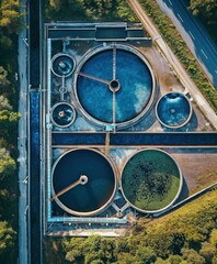 Aerial View of a Sewage Treatment Plant at Dusk Featuring Circular Tanks