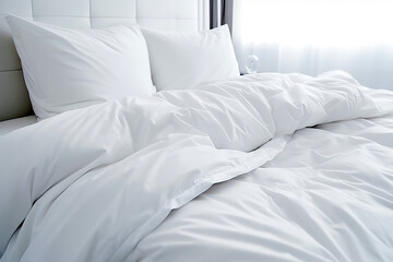 Close up of folded duvet on white bed in the background of modern bedroom. Building concepts and healing and relaxation.