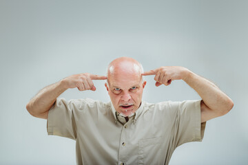 Telepathic gesture, elder concentrates with serious demeanor