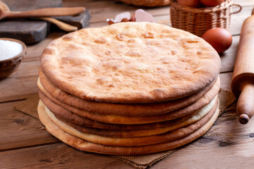 Tasty crispy baked round puff pastry layers of homemade cake on a table.