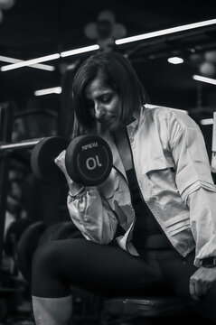 female at the gym black and white image with high contrast