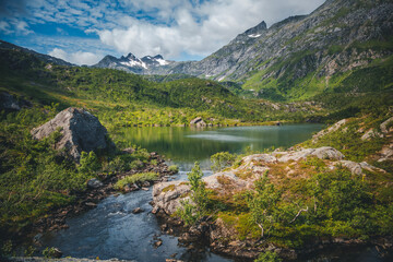 Fototapeta na wymiar Beautiful Scandinavian landscape, mountains and a lake on the Vesteralen archipelago. Travel to Norway