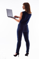 Woman laptop white background. Business woman stands with laptop computer. Studio portrait of businesswoman with laptop. Concept - software for business. Businesswoman uses some kind of software