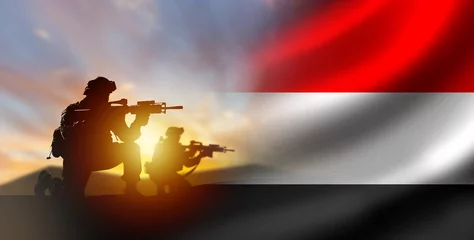 Foto op Plexiglas Soldiers with Yemen flag. Silhouettes of fighters at sunset. Yemen army. Military anti-terrorist operation concept. Soldiers state army. Yemen armed forces. Defense and anti-invasion forces. 3d image © Grispb