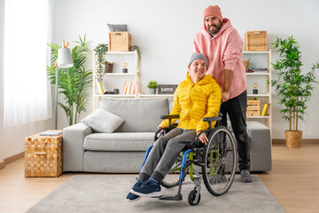 Portrait of a caregiver and a disabled man at home