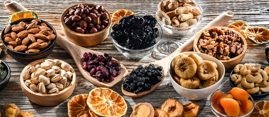 Composition with a variety of dried fruits and assorted nuts.