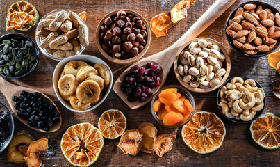 Composition with a variety of dried fruits and assorted nuts.