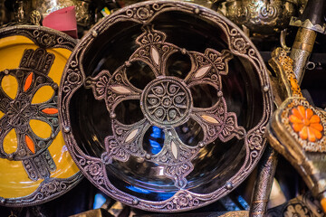 Marrakech, Morocco - March 28, 2022: All kinds of souvenirs exhibited in a shop in the ancient district of Medina in Marrakech.
