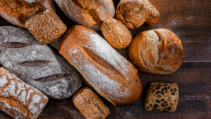 Assorted bakery products including loaves of bread and rolls