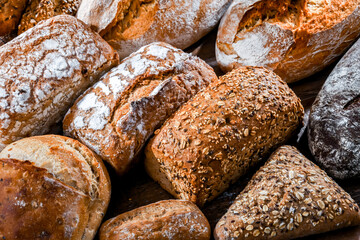 Assorted bakery products including loaves of bread and rolls