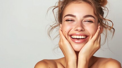 Happy beautiful girl holding her cheeks with a laugh looking to the side. Pretty woman clean fresh skin . Expressive facial expressions .Cosmetology , beauty and Spa